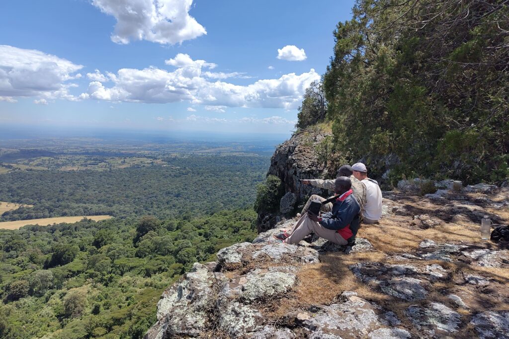 3 people enjoying view from Endebess Bluff